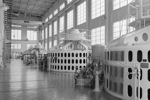 The generator hall at Holter Dam powerhouse, Montana, lined with Westinghouse machines.
